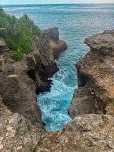 Turquoise water surrounding some of the cliffs at Nusa Lembongan's Secret Lagoon