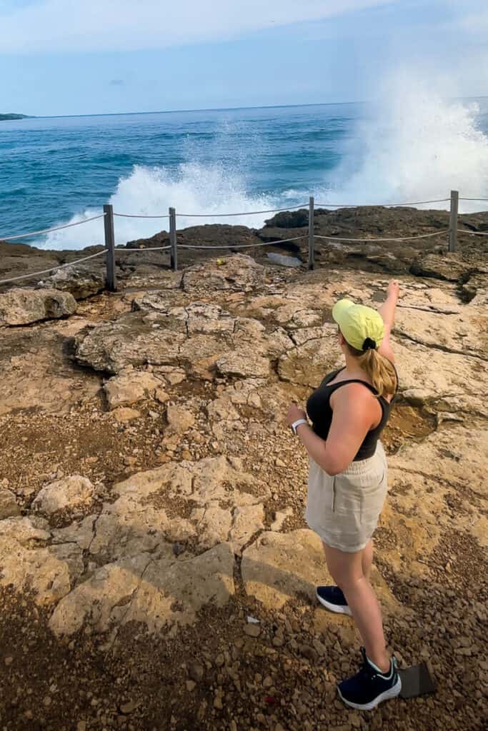 Standing in front of the the Devil's Tears Blow Hole on Nusa Lembongan during low tide.
