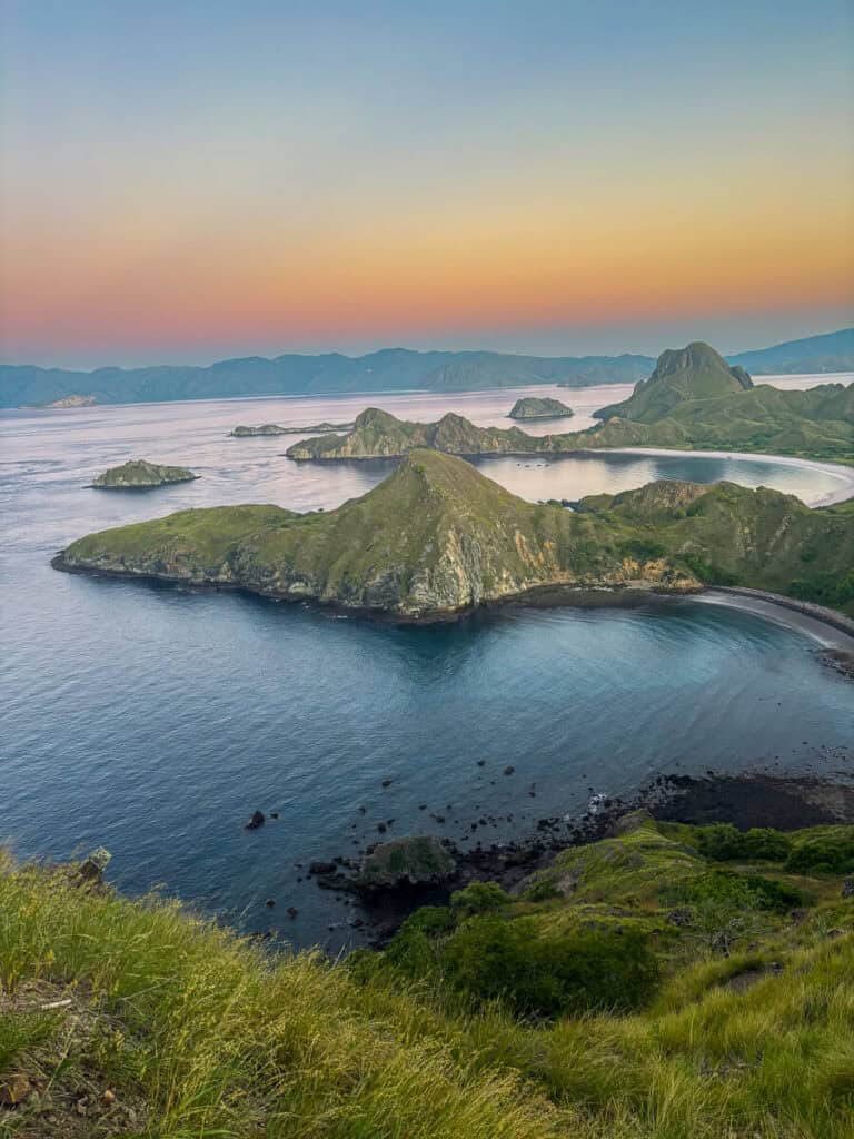 Sunrise over Padar Island in Komodo National Park is full of colors and highlights the peaks and valleys of the island below
