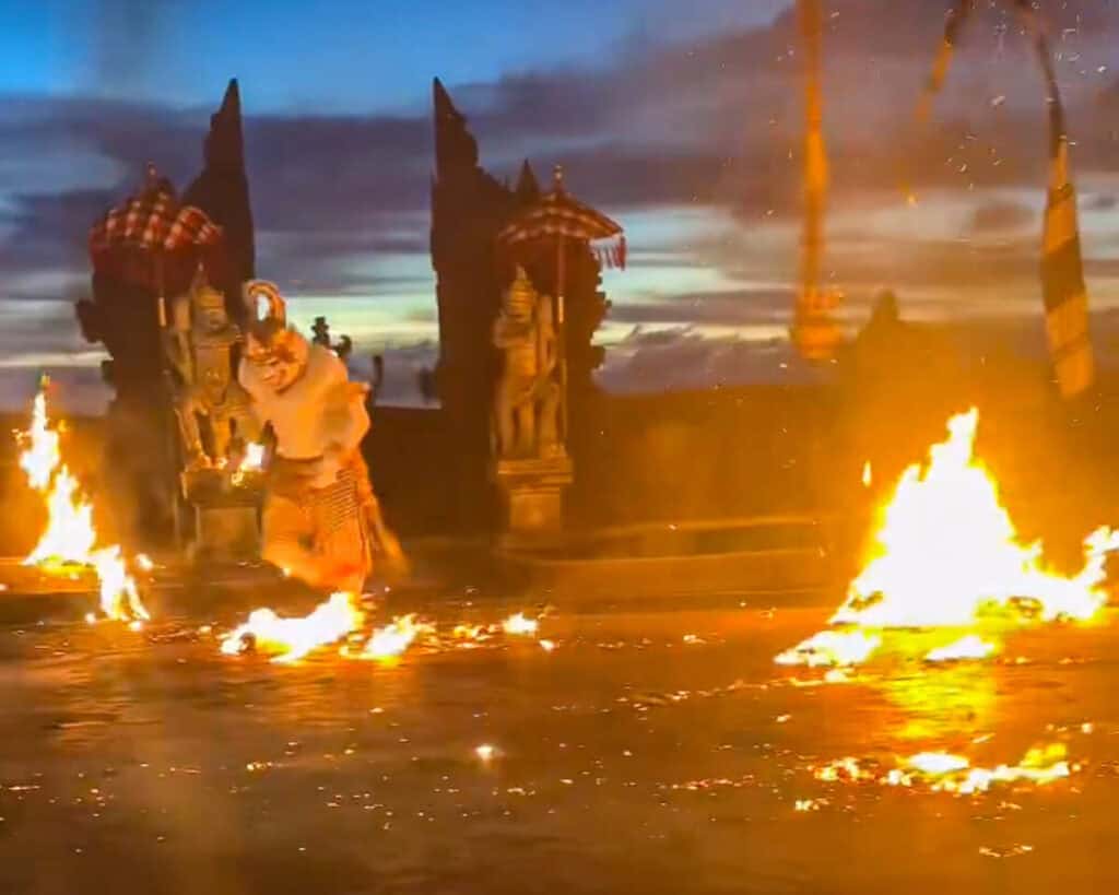 The Monkey King does his solo choreography kicking the fire around the stage of the Kecak Dance