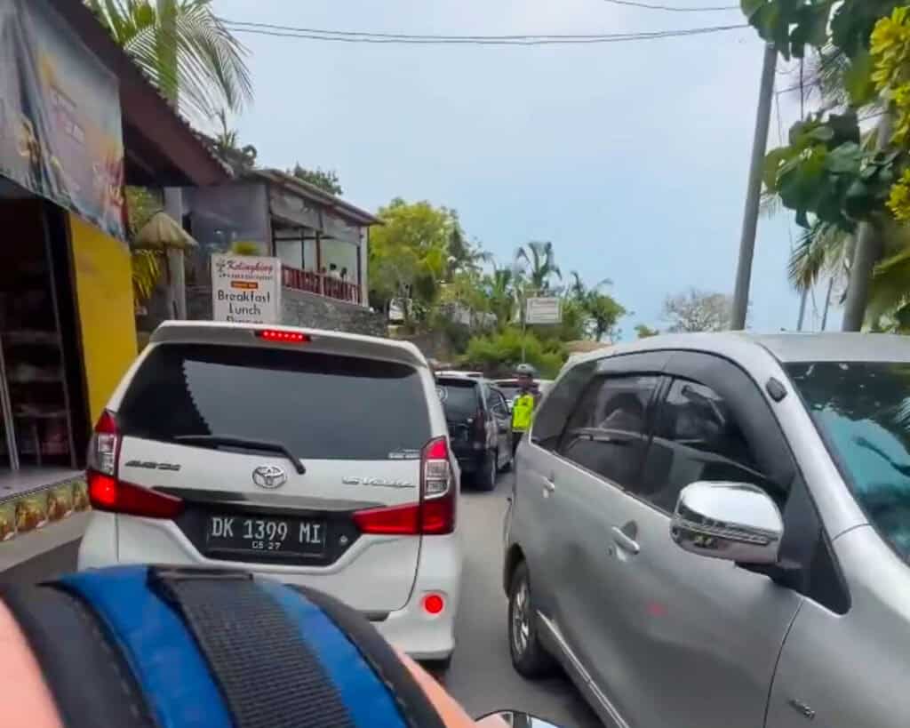 Stuck in standstill traffic when leaving KelingKing Beach in Nusa Penida with no space for scooters to pass the tour vans
