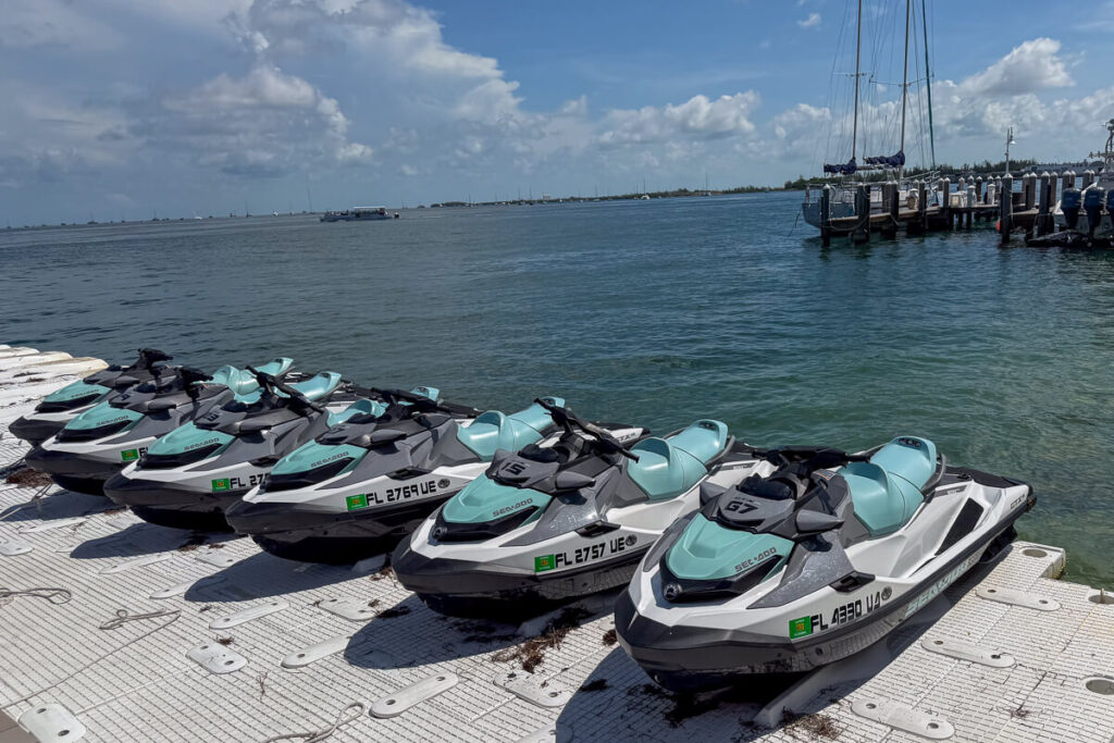 Sea-Doos lined up at a dock before a Fury Adventures jet ski tour in Key West.