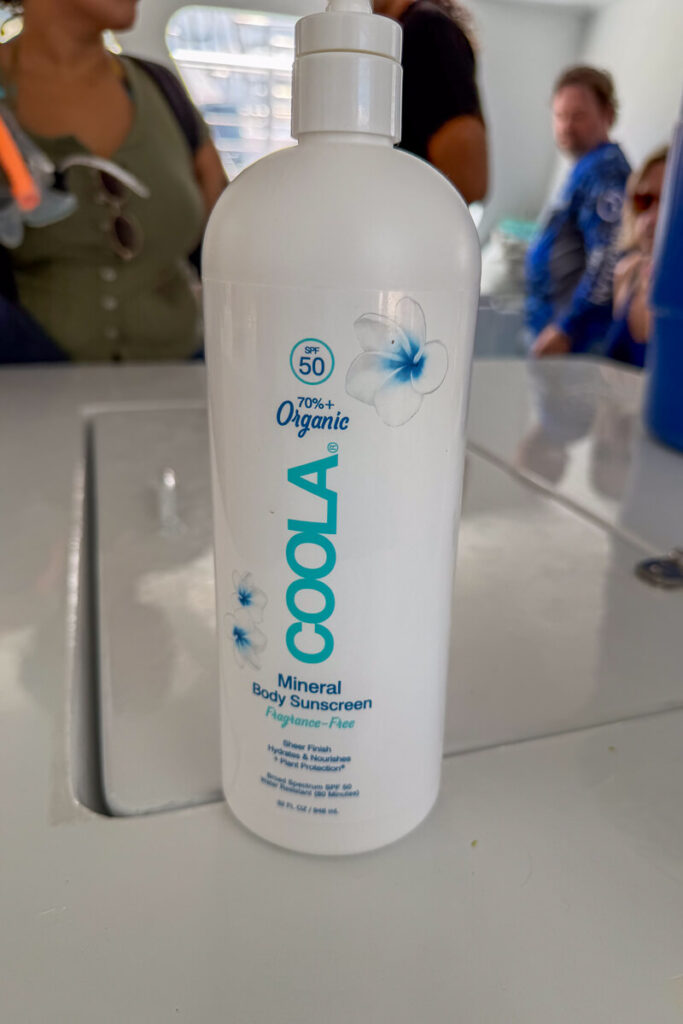 Bottle of SPF 50 mineral sunscreen provided aboard the Fury snorkeling boat.